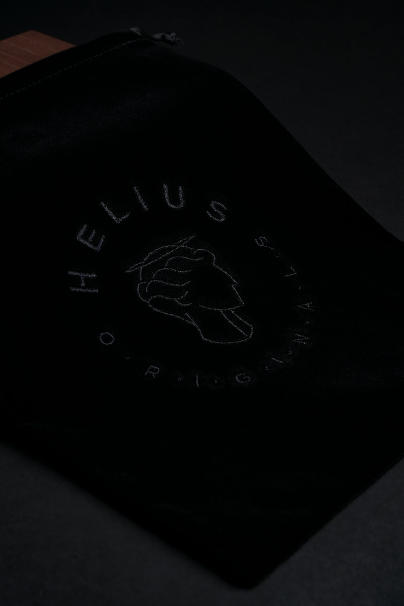 Luxury black velvet storage bag with Helius Originals logo, premium eco-luxury packaging for cocktail smoker kits and gifting