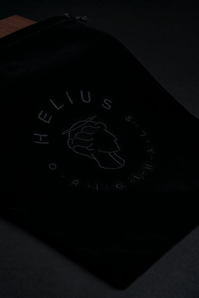 Luxury black velvet storage bag with Helius Originals logo, premium eco-luxury packaging for cocktail smoker kits and gifting
