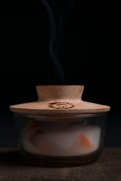 Smoked salmon infused with aromatic wood using the Helius Originals cocktail smoker, eco-luxury barware made from reclaimed Ontario wood