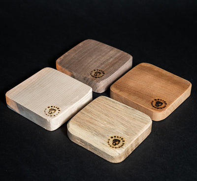 Set of four Helius Originals Wood Boards in different Ontario hardwoods, crafted for smoking cocktails and gourmet food.